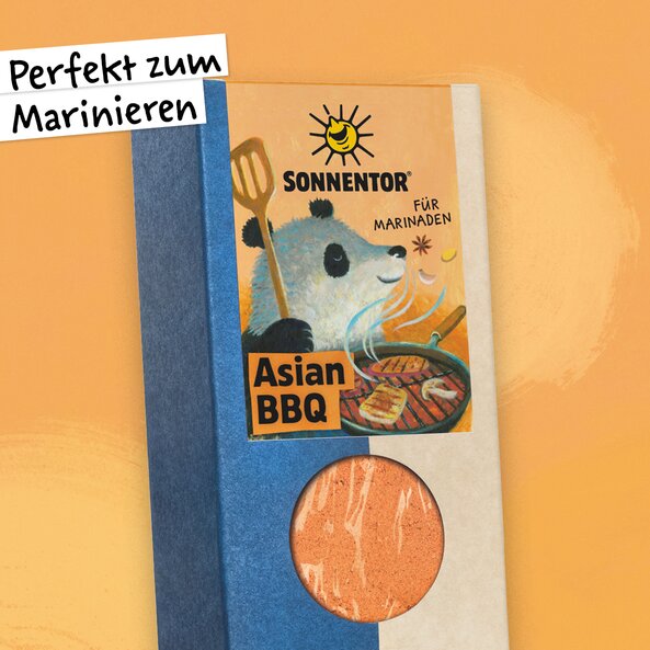 Asian BBQ spice in a pack with a window and panda illustration on a light orange background and the words: ‘Perfect for marinating’.